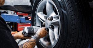 Mag & Turbo technician working on a wheel during a puncture repair.